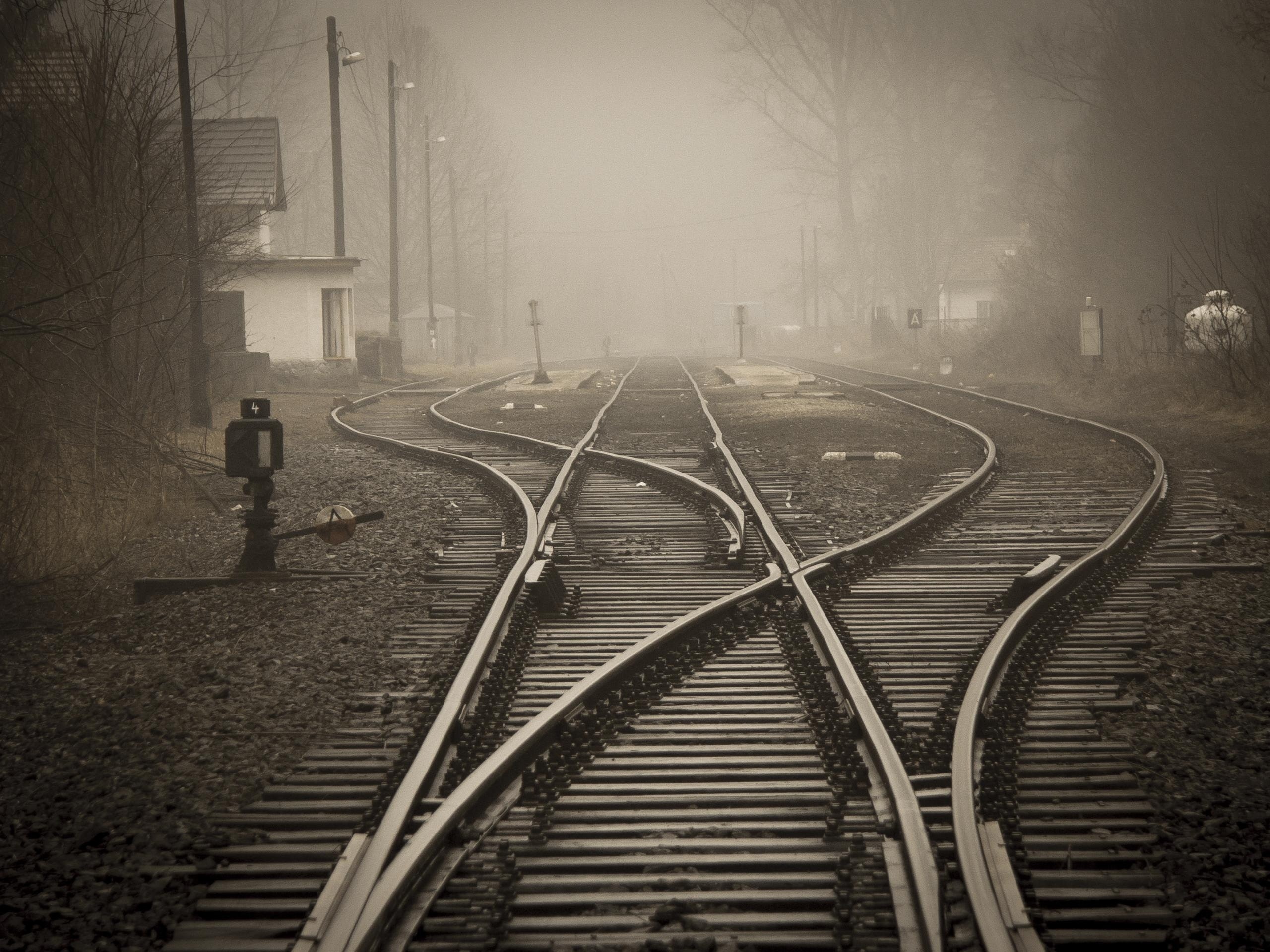 Hazy photo of train tracks splitting off